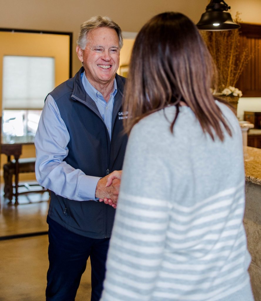 Kyle Stripling of Galloway Insurance assisting a client with flood insurance in Texas.